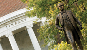 A bronze statue of UNCG's Founder and First President Charles Duncan McIver also known as Charlie stands near the center of campus in front of Jackson Library.