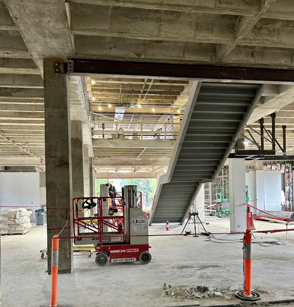 The underside of a staircase in a construction area.