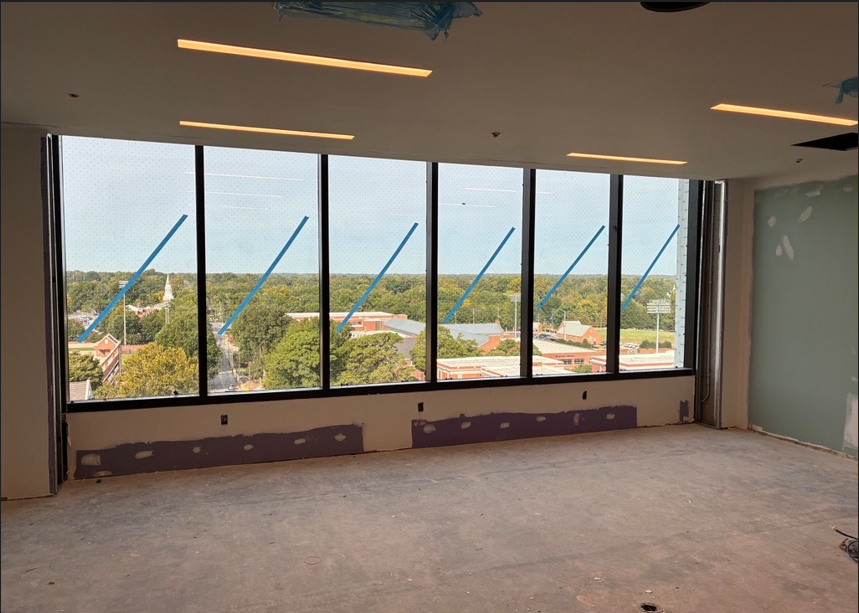 Six large window panes inside of a construction site.